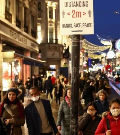 people-walk-along-regent-street-amid-the-coronavirus-disease-covid-19-outbreak-in-london