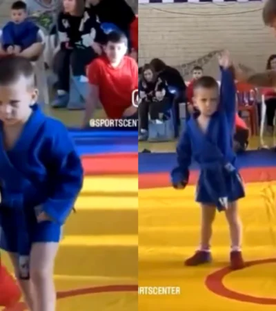 El niño enfrenta una lucha grecorromana con una expresión facial que ha generado risas en internet.