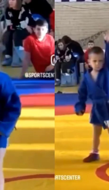 El niño enfrenta una lucha grecorromana con una expresión facial que ha generado risas en internet.